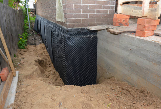 Happy homeowners after waterproofing job in Malverne